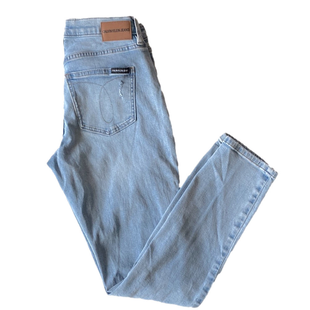 Calvin Klein faded ripped jeans. 25